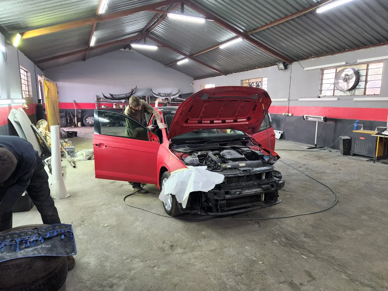 Panel beater at work — accident damage repair in Centurion